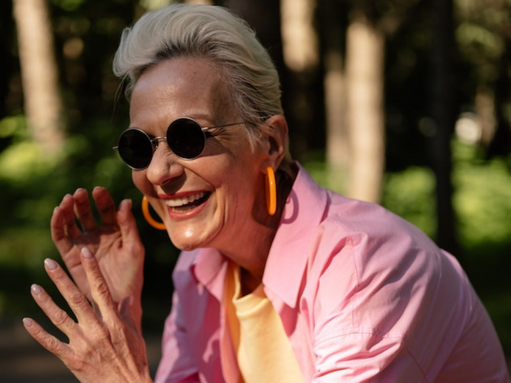 Woman with sunglasses and pink shirt Woman with sunglasses and pink shirt