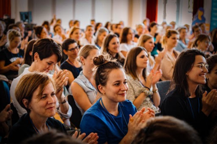 Women at event Women clapping hands at an event