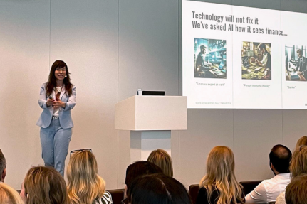 Workforce Empowerment Olga Miler speaking in front of audience