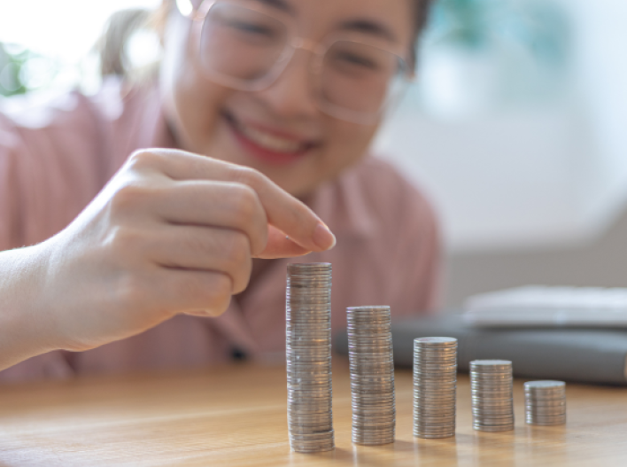 Woman counting coins